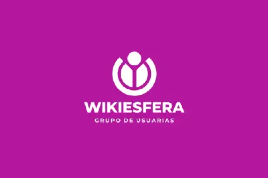 Logotipo blanco en el que aparece una figura humana circular y abstracta sobre el texto «WIKIESFERA GRUPO DE USUARIAS» en mayúsculas, centrado sobre un fondo morado liso; un diseño que rinde homenaje a la presencia de ilustradoras y artistas del cómic en Wikipedia.